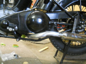 Under wrapping exhaust, left side